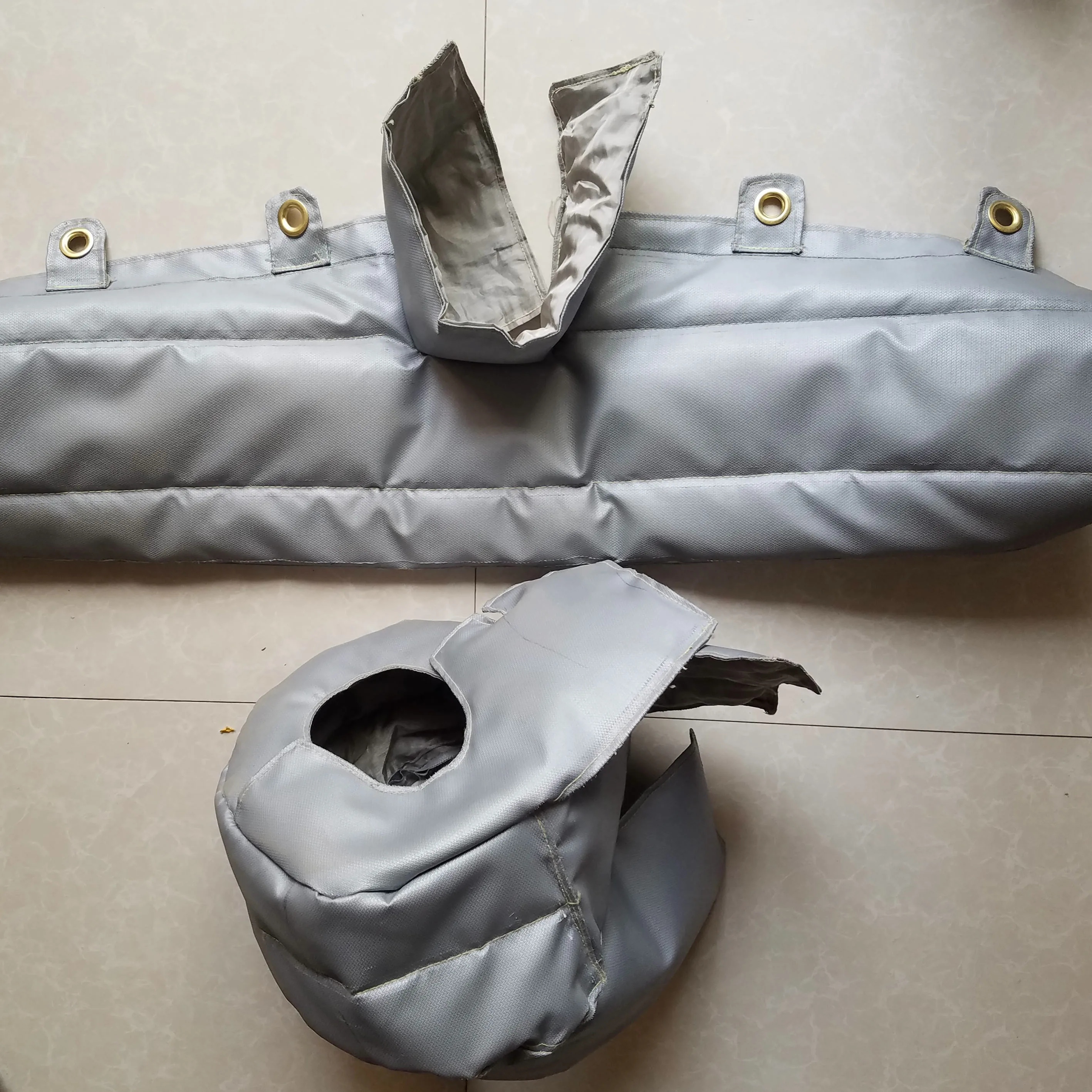 Sewn gray silicone-coated fiberglass protective covers with reinforced eyelets