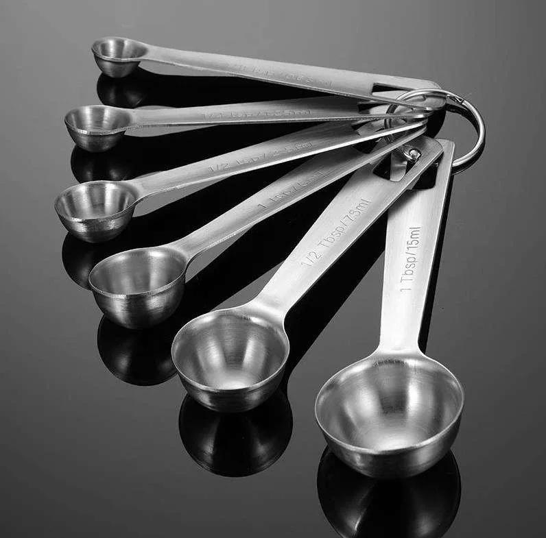 Reusable stainless steel measuring spoon set showing several bowl capacities
