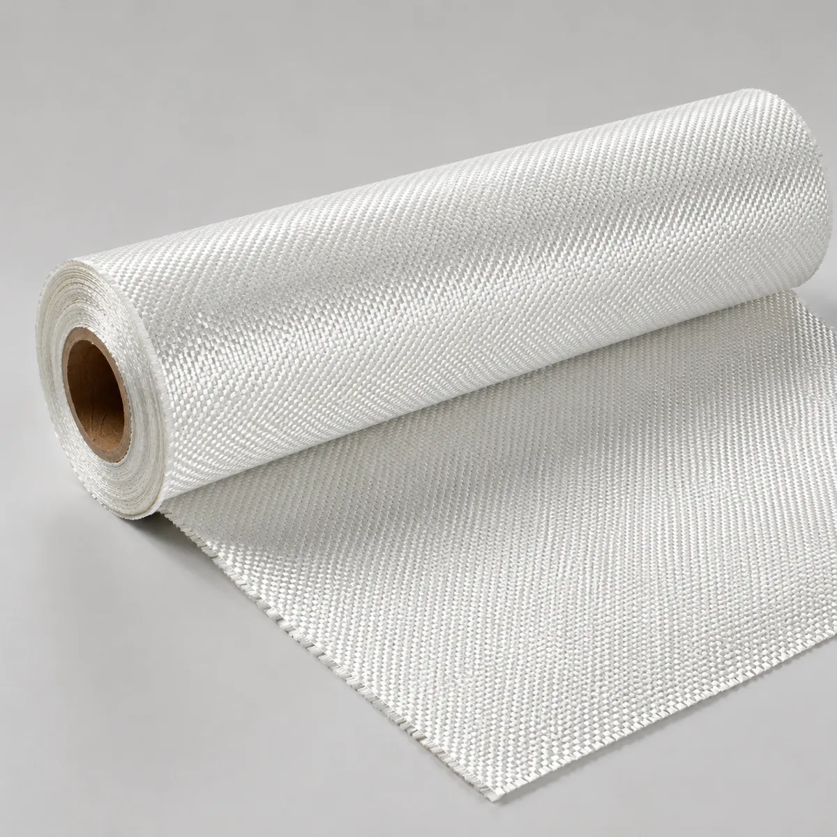 Woven fiberglass cloth roll on a clean gray background